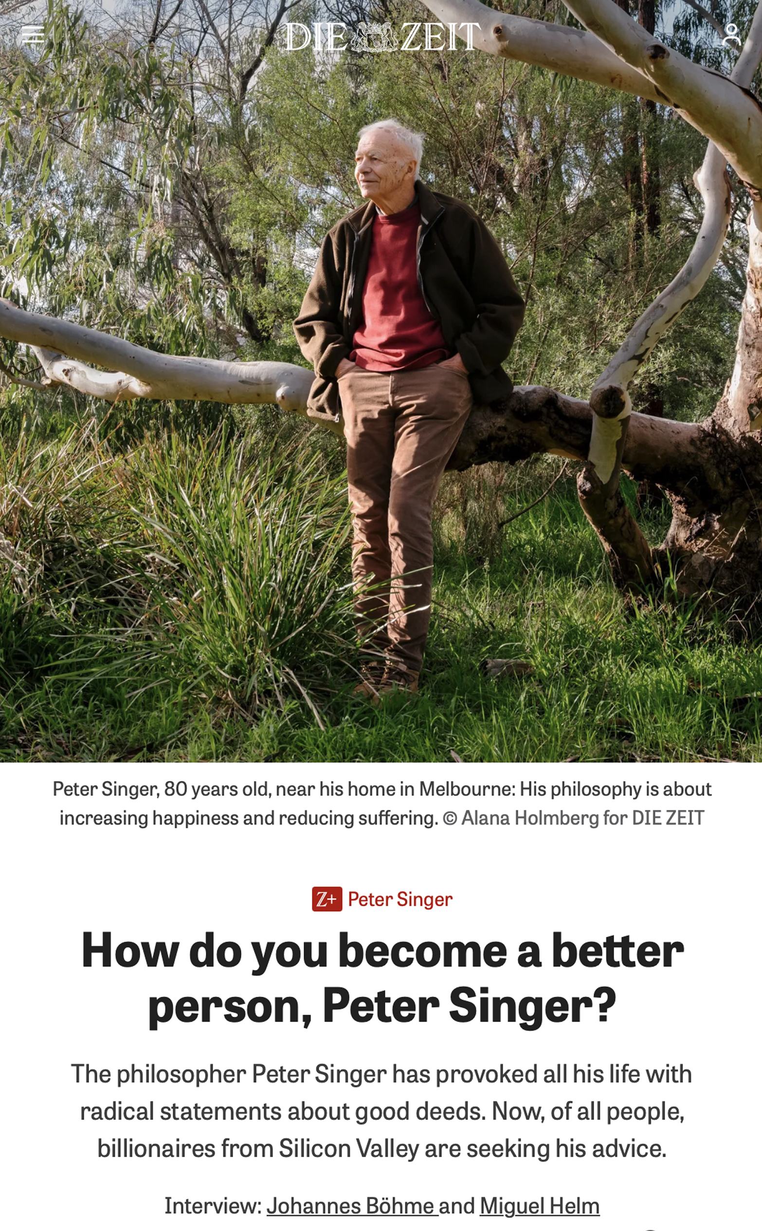 Peter Singer standing among trees near his home in Melbourne